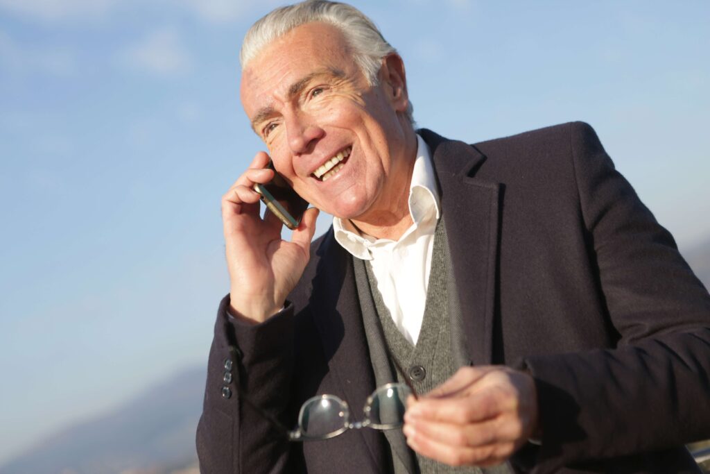 man smiling on cell phone