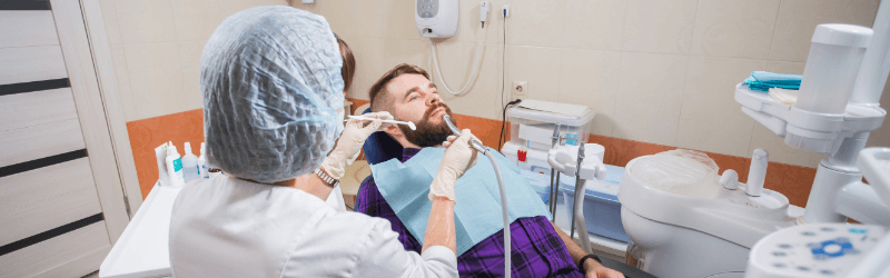 Dental Doctor Treating Patient