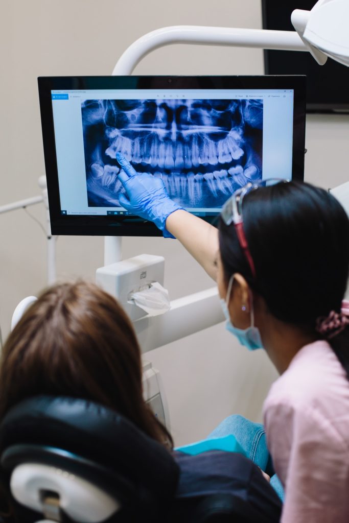  dentist pointing to xray