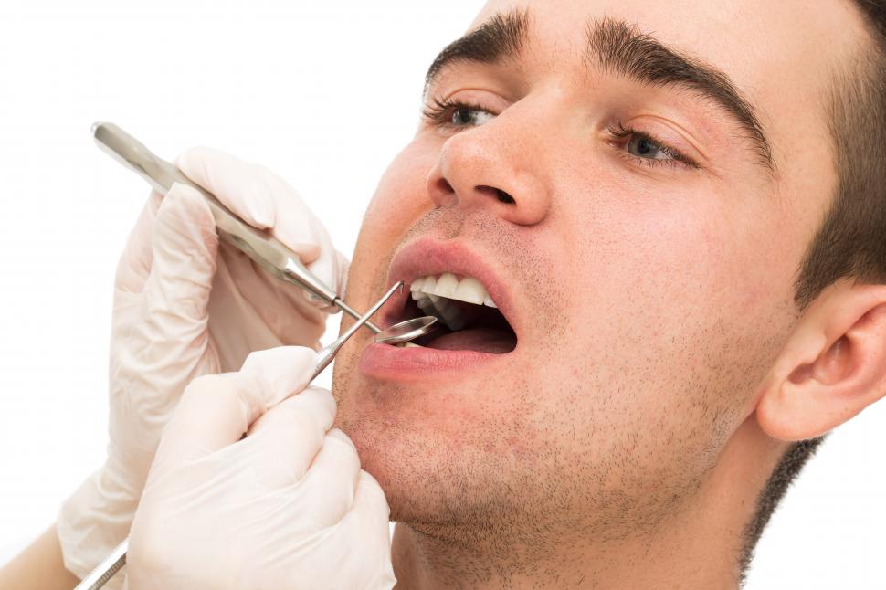 A man receiving a dental check-up