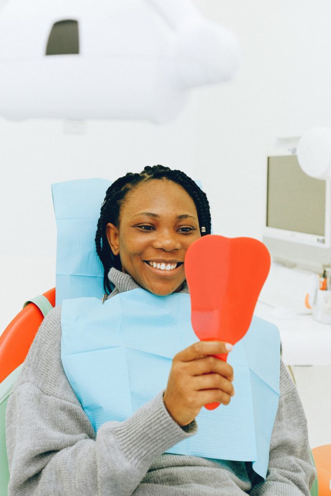 woman-in-chair-implant-retained-dentures