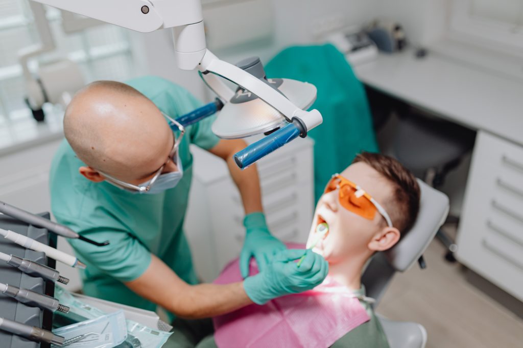 A dentist treating a patient with early signs of gum disease