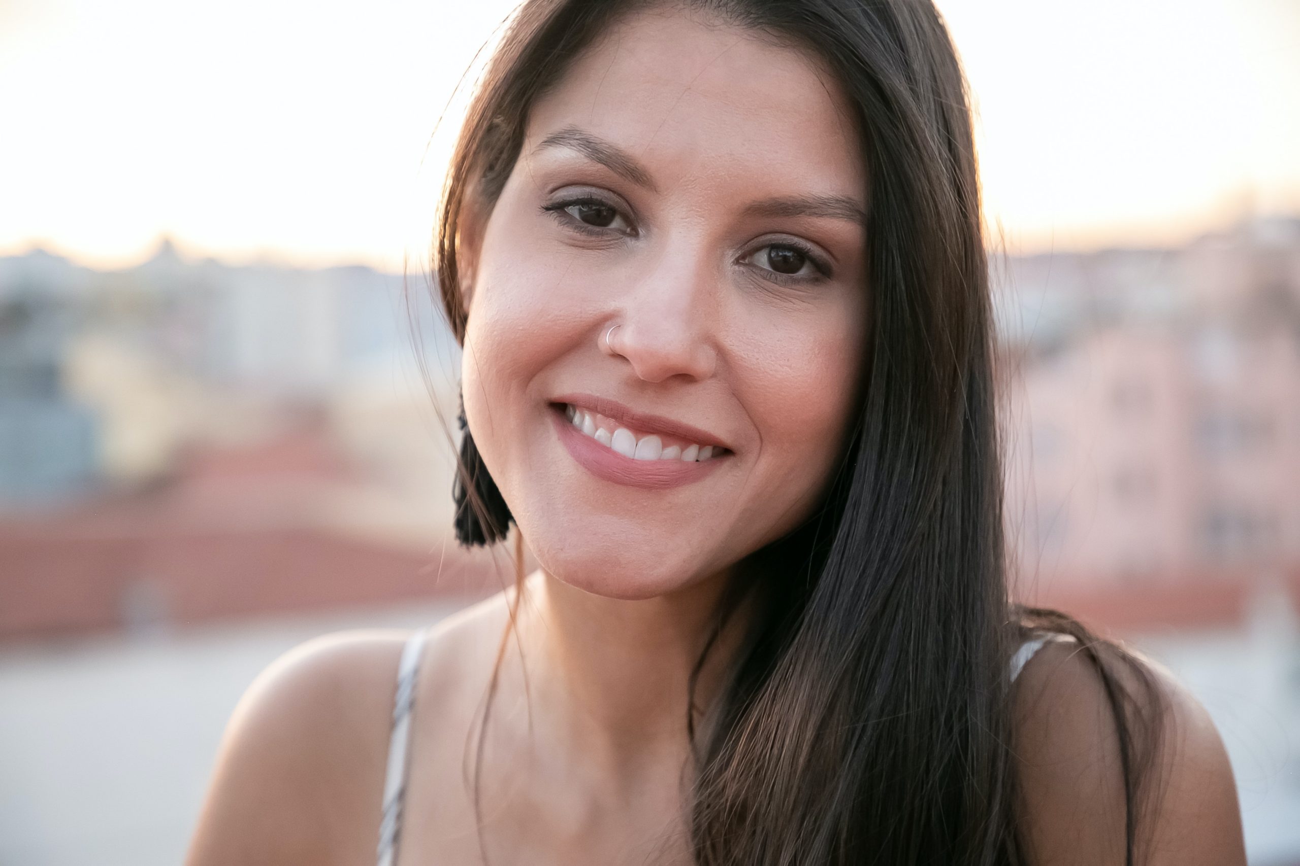 A woman smiling after getting rid of gum disease