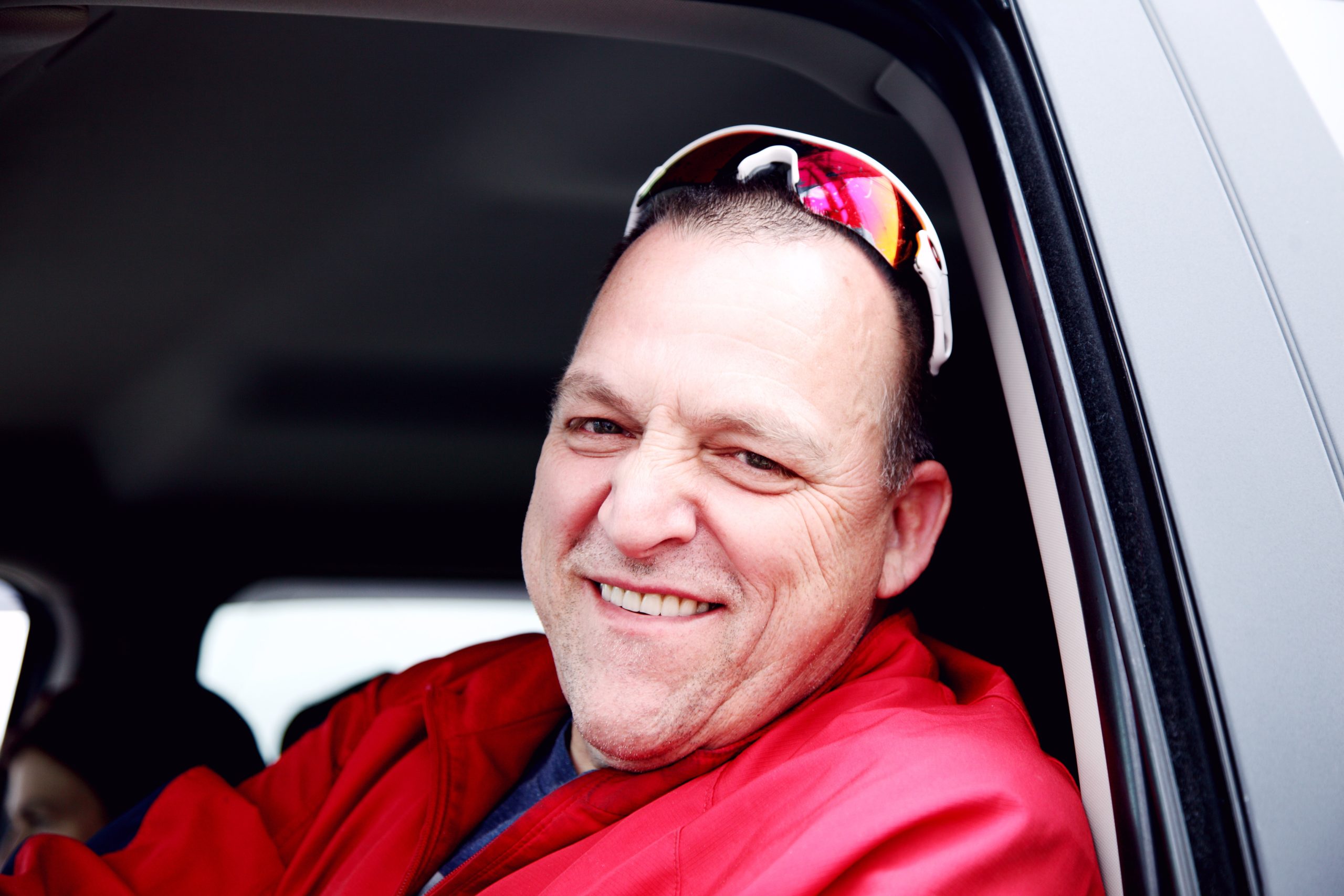 A man smiling after removing stains from his teeth