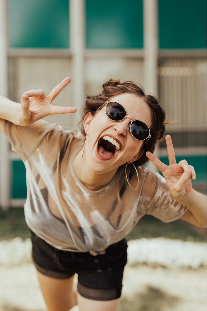 woman smiling with sunglasses