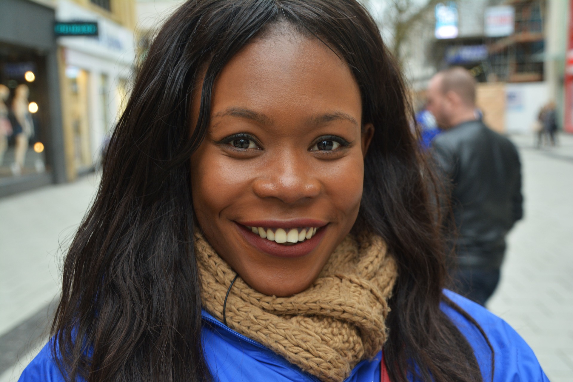 woman with a scarf smiling